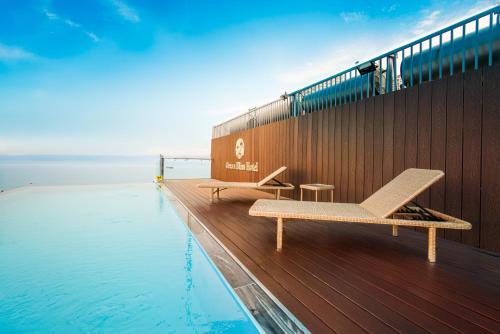 a swimming pool on the deck of a cruise ship at Ocean Bliss Hotel - Free Sauna in Da Nang