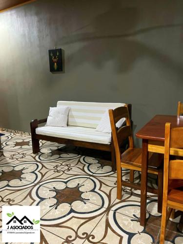 a couch sitting on top of a room with a table at Apartamento Lulú in Uvita