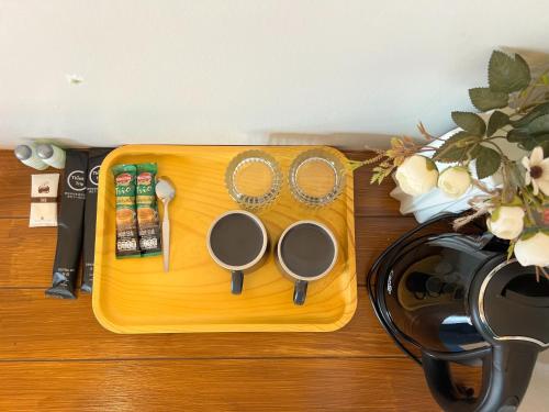 a cutting board with two pairs of scissors and a pair thereof at Idin Klin Pha Man in Ban Nong Pla Siu
