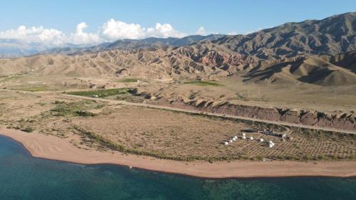 an aerial view of an island in the middle of the ocean at AiSun Eco Yurt Camp in Tossor