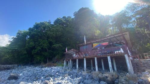 a house on a pile of rocks on a hill at Tioman Beruntun Hideaway in Tioman Island