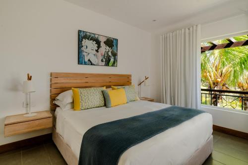 Una cama o camas en una habitación de Heritage The Villas