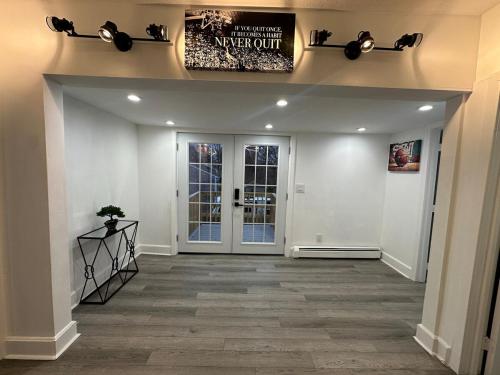 a hallway of a house with a sign on the wall at Family-friendly for travelers in Warwick