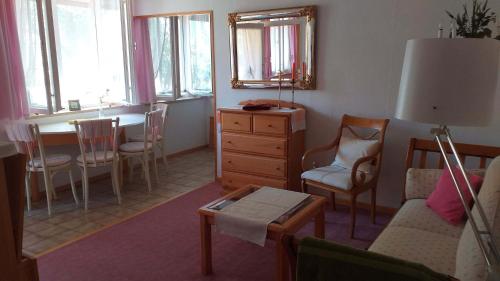 a living room with a table and a dining room at Ferienwohnung Kuschel in Thanstein