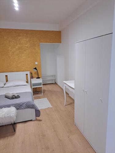 a bedroom with a bed and a white closet at Sweet home in Rab