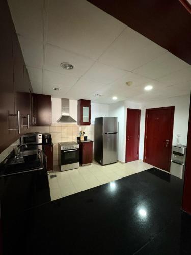 Η κουζίνα ή μικρή κουζίνα στο Horizon Rooms JBR