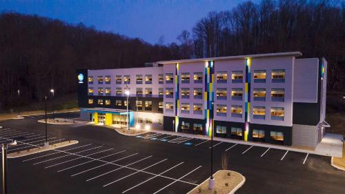 a large building in a parking lot at night at Tru By Hilton West Bristol Tn in Bristol