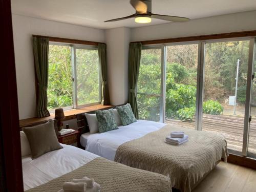 Ένα ή περισσότερα κρεβάτια σε δωμάτιο στο Painagama House