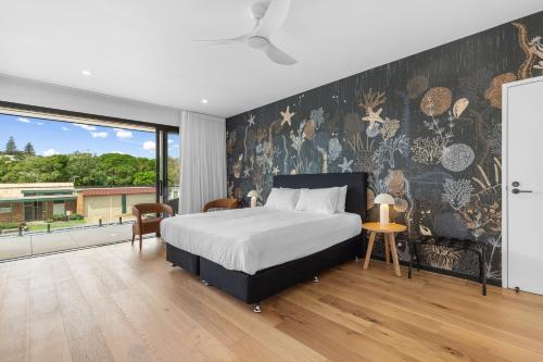 Cama ou camas em um quarto em Beach St Accommodation