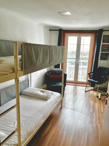a bedroom with two bunk beds and a window at 4Lisbon Downtown Private Bedroom City View in Lisbon