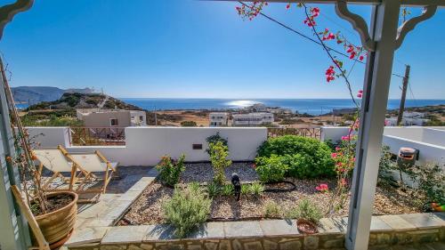 a view of the garden from the balcony of a house at Kalliope Studios Karpathos in Amoopi
