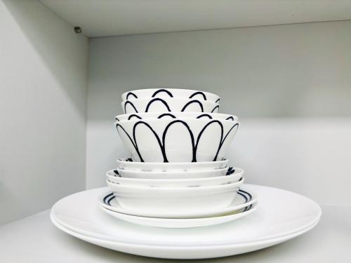a white cake sitting on top of white plates at stayok Okpo, center of Geoje in Geoje 