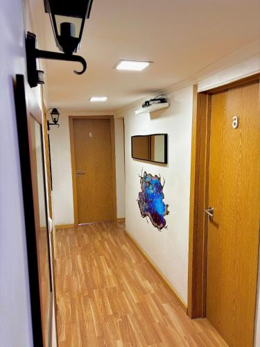 an empty room with a hallway with a door at 7Lisbon Downtown Private Bedroom With Balcony in Lisbon