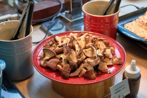 a red plate of food on a table at Okayama Koraku Hotel in Okayama