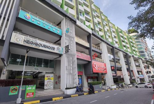 a large building on a city street with a street at 2BR Lively City View Family Suite#Airport in Bayan Lepas