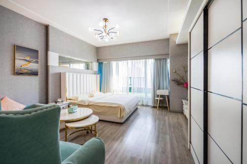 a hotel room with a bed and a table at Tech-X Jing'an Hotel in Shanghai