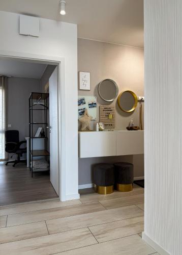 a room with two mirrors on a wall and a hallway at Ferien am Möhnesee - Cozy Home in Möhnesee