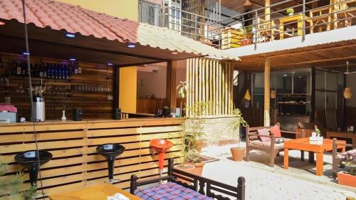 a patio of a restaurant with tables and chairs at Great Doors Thamel in Kathmandu