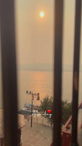 a view of the ocean from a window of a room at Tandon Lodge On The Ganga Ghat Homestay in Varanasi
