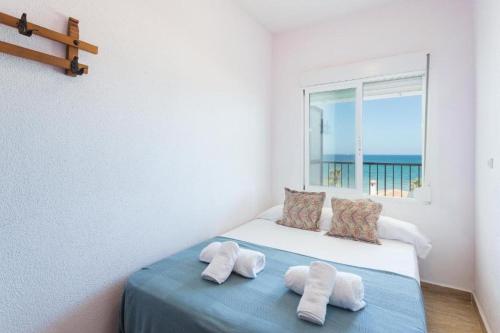 Postel nebo postele na pokoji v ubytování Playa de Miramar Vistas Al Mar