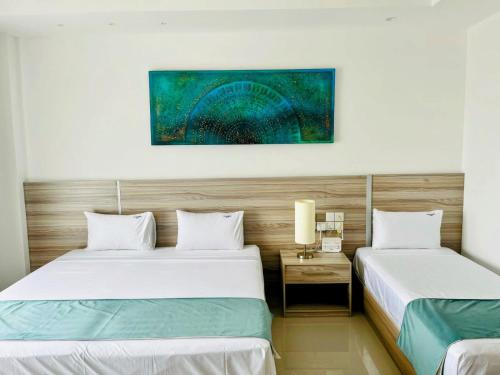 Postel nebo postele na pokoji v ubytování Negombo Ocean Breeze Luxury Studio by Serendib Vacation