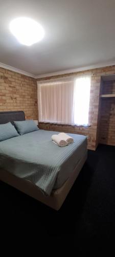 Postel nebo postele na pokoji v ubytování Kalbarri Holiday Villas C