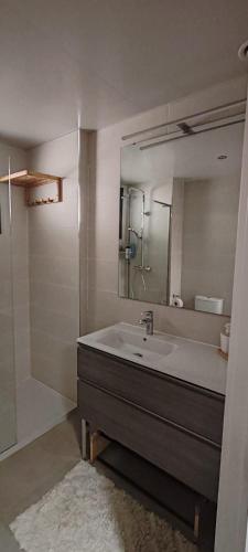a bathroom with a sink and a mirror at Malvagon Isla Canela los flamencos in Isla Canela