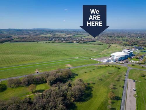 an aerial view of a building in a field at Cozy Maisonette in Langley Vale in Kingswood Warren