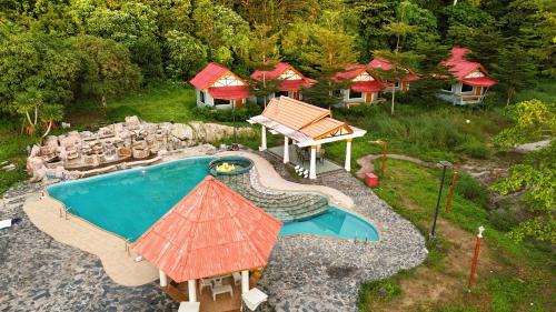 an aerial view of a swimming pool with a resort at Koh Chang Cabana Resort with swiming pool & BEACH in Ko Chang