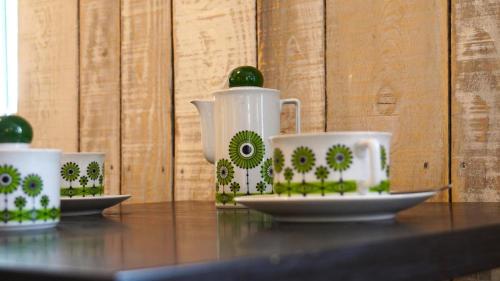 three cups and saucers sitting on a table at Ariane in Vichy