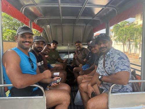 a group of men sitting on a bus at Angel Pool Villa Phuket - SHA Extra Plus in Phuket Town