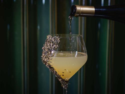 a drink being poured into a wine glass at Mercure Ponta Delgada Azores in Ponta Delgada