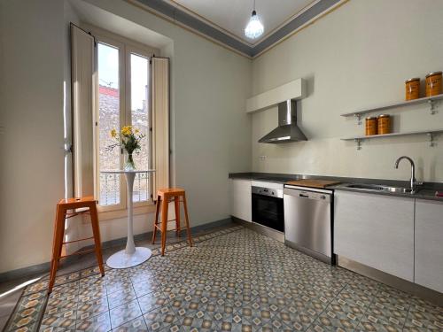a kitchen with a sink and a dishwasher at Casa Estela Agullana in Agullana