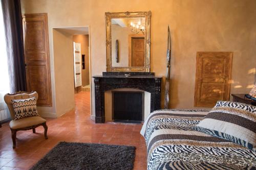 En eller flere senge i et værelse på O'palmier Caché