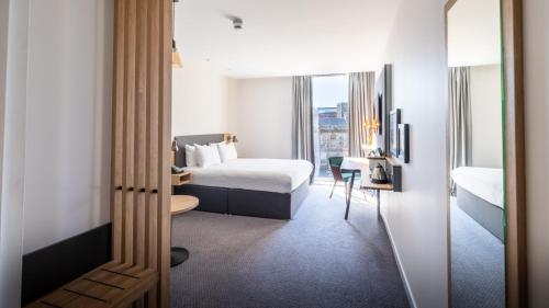 a hotel room with a bed and a window at Holiday Inn Sunderland - City Centre by IHG in Sunderland
