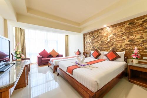 Postel nebo postele na pokoji v ubytování Boutique Paradise Hotel