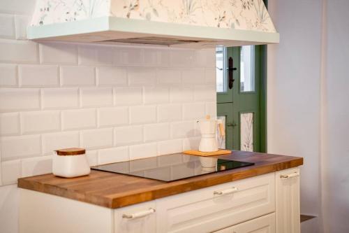 a kitchen with a counter top with a sink at MoM Comillas in Comillas