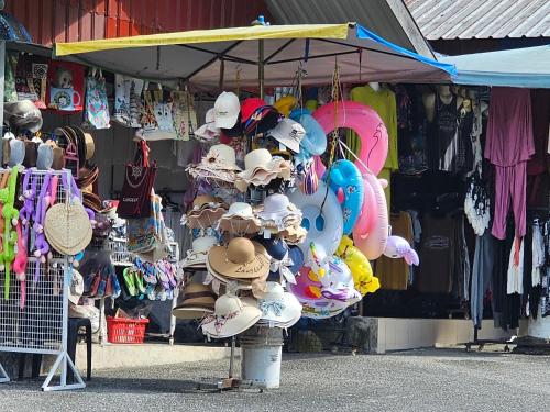 a store with hats and other items on display at Triima Inn Tanjung Rhu by Perfect Host in Air Hangat