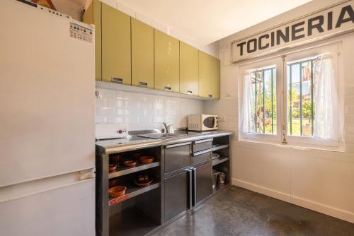Kuchyň nebo kuchyňský kout v ubytování La Fabriqueta Apartament
