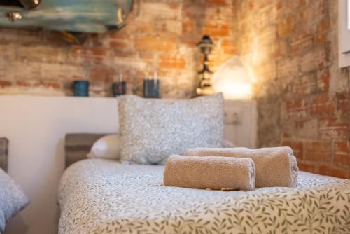 Postel nebo postele na pokoji v ubytování La Fabriqueta Apartament