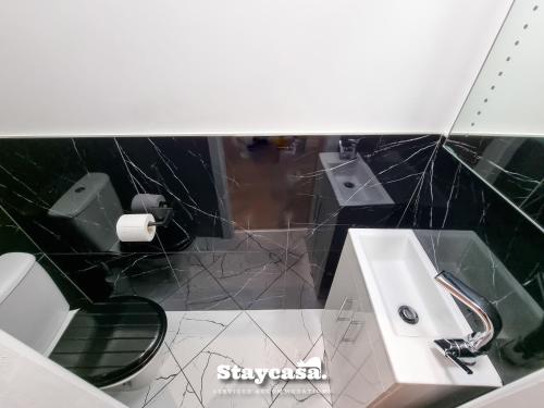 a bathroom with a sink and a toilet at Clarence Co-living - Private Room Self-cater in Manchester