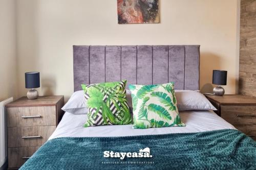 a bedroom with a bed with two night stands at Clarence Co-living - Private Room Self-cater in Manchester