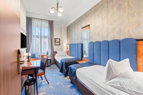 Postel nebo postele na pokoji v ubytování Hotel Diament Plaza Gliwice
