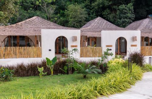 a house in the middle of a garden at Cape Beach Villa Samui in Ban Bang Po