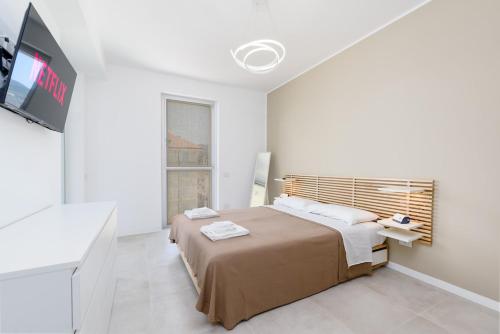 En eller flere senge i et værelse på -DeLuxe Vision- Fronte Mare, Spiaggia e Parcheggio