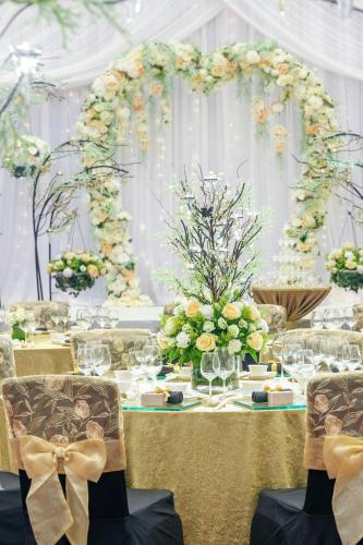 a table with a bunch of flowers on it at Sheraton Towers Singapore Hotel in Singapore