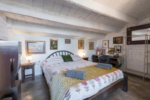 a bedroom with a large bed in a room at La Fabriqueta Apartament Loft in Ríudecañas