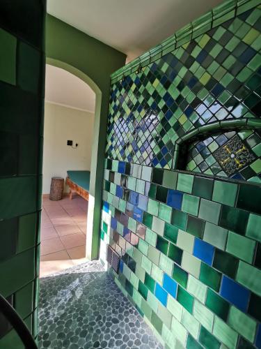 a room with a tiled wall with a tile floor at Ferienhaus mit Sauna "Waldrausch" - An der Rehwiese 1 RE01 in Sögel
