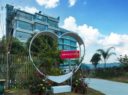 a heart sculpture in front of a building at Lanshan Moon Resort in Yangshuo