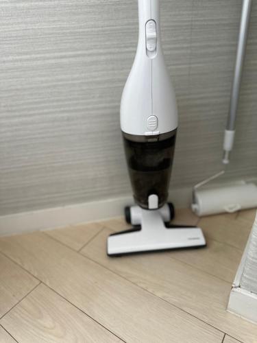 a remote control sitting on top of a floor at JOJO TC house in Osaka